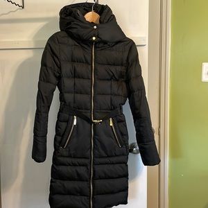 Black Vince Camuto knee length winter puffer coat.